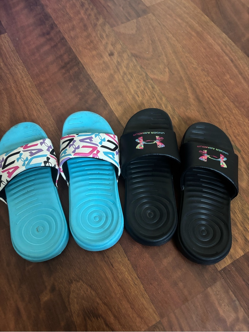 Under Armour Kids Slide Sandals in Black and Bright Blue with Patterned Strap